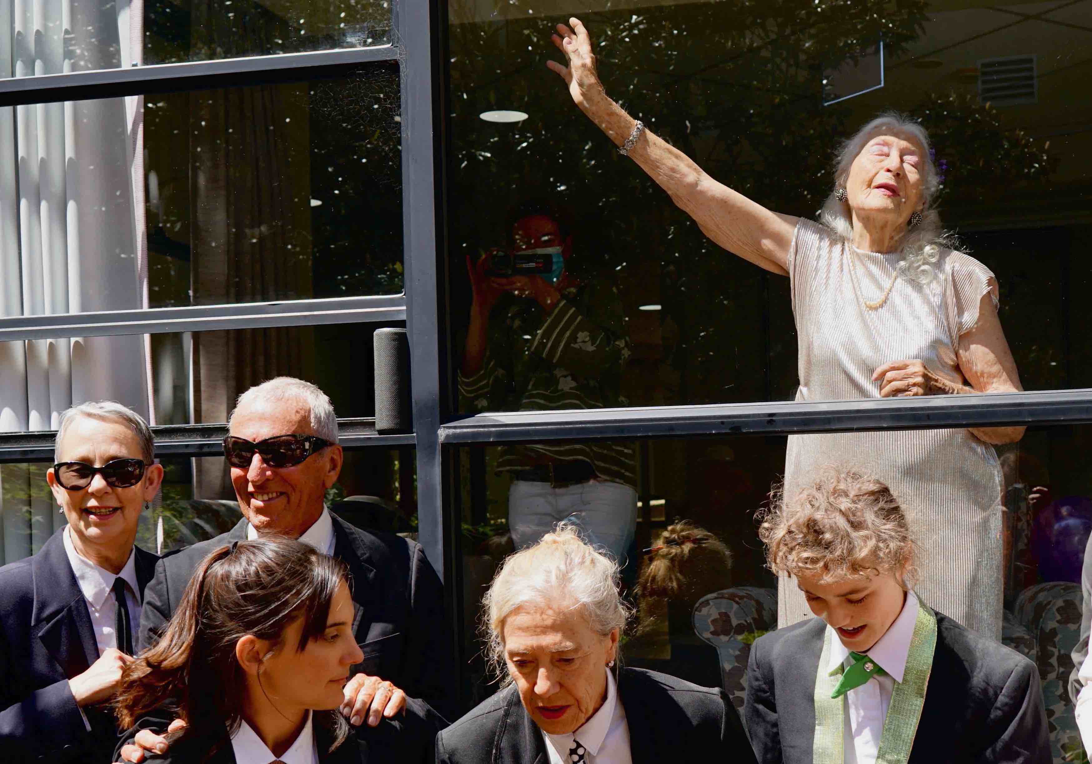 Eileen gestures dramatically after the performance