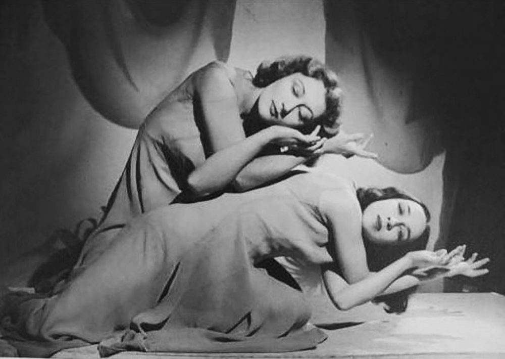 Two dancers leaning to their left